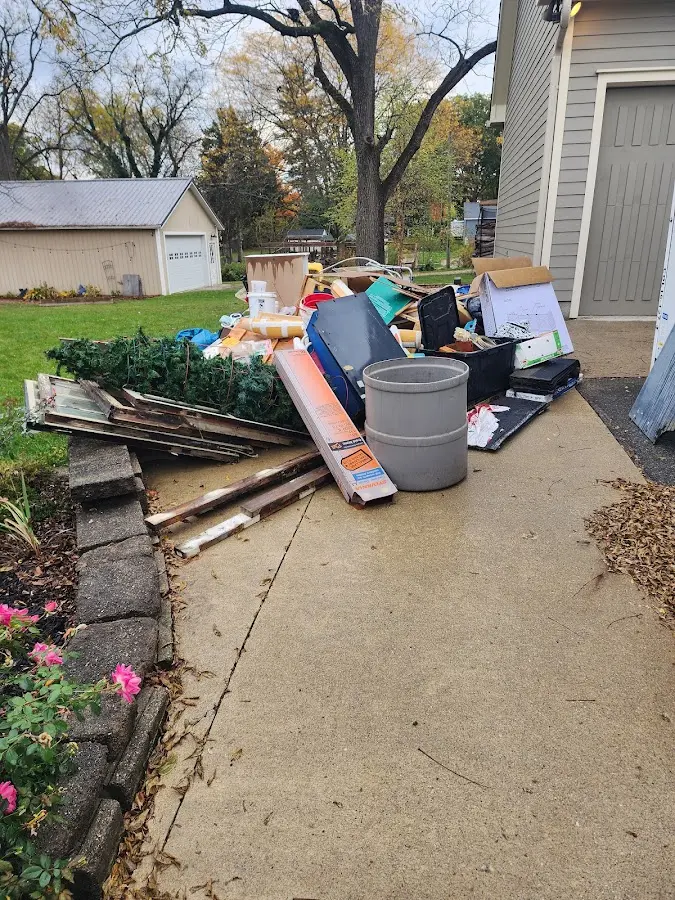 Dumpster being loaded with debris for Estate Cleanout Dumpster Rental in Aliso Viejo